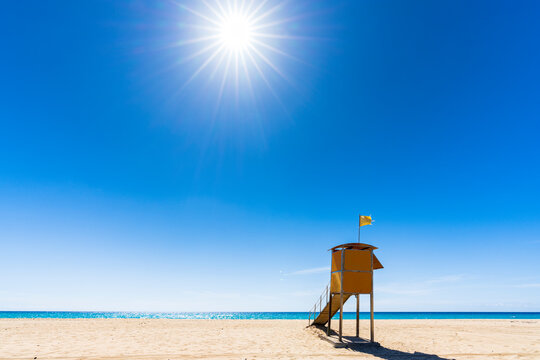 Sun shining over the lifeguard's cabin by the ocean, Morro Jable, Fuerteventura, Canary Islands, Spain