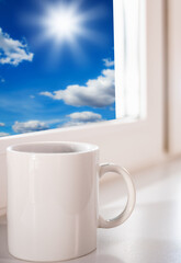 cup of coffee on the window sill