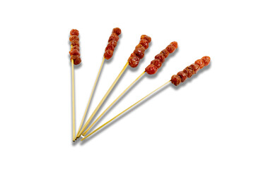 Sweet and sour gooseberry is skewed with bamboo. On a white background. Clipping path.