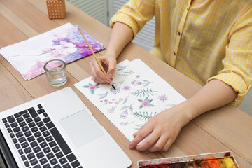 Woman drawing picture at online art lesson indoors, closeup. Distant learning
