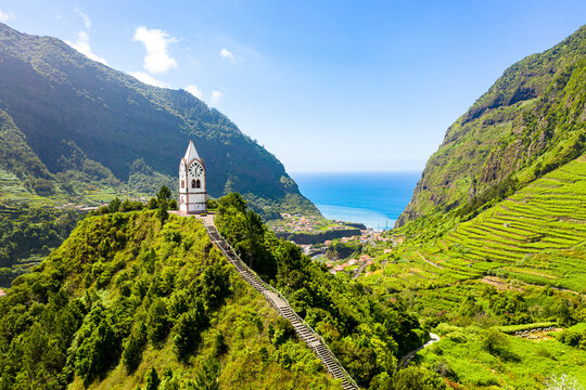 The chapel-tower Nossa Senhora de Fatima on top of green hills, Sao Vicente, Madeira island, Portugal