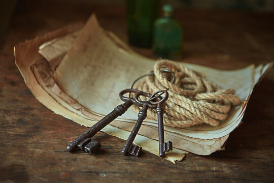 Antique objects of a treasure hunter, traveler and discoverer - ancient manuscripts, keys to chests. The concept of adventure, prison escape, good luck and romance.