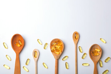 Omega 3 capsules on a white background with place for text.