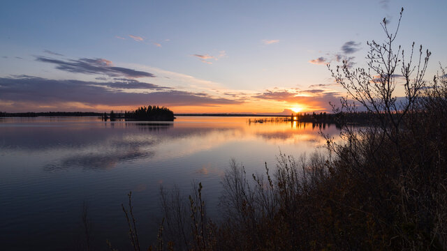 Colourful sunset in Spring at Astotin Lake, Elk Island National Park, Alberta, Canada