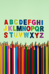 Alphabet lettering with wooden colored pencil