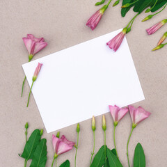 Floral arrangement of pink wildflowers on a gray background .Greeting card with place for design.