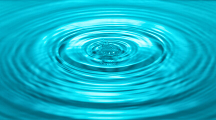 falling drops on the water surface, splash, ripples on the water, blue color