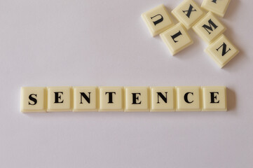 Alphabet letters with text SENTENCE isolated on white background.