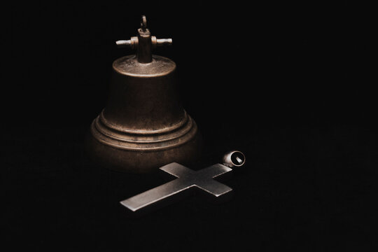 Cross and bell.