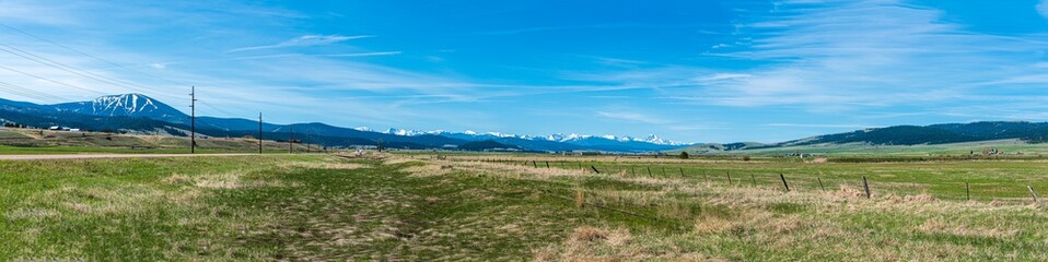 Fototapeta na wymiar Panorama of the Flint Creek Valley in Montana from Mount Rumsey to the Western Valley Ridge with the Snow-Capped Anaconda Mountain Range in the Background
