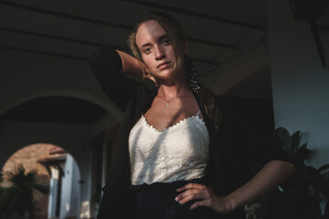 portrait of blonde girl with black jacket and white t-shirt