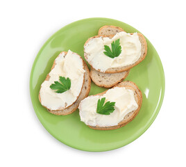 Bread with cream cheese and parsley on white background, top view