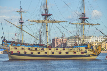 the water an old sailing frigate with guns