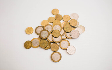stack of coins made from different material on the white background