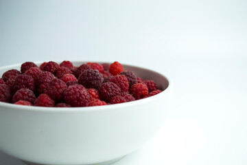 Close-up shot of fresh raspberries - perfect for a culinary blog diet and the benefits of natural vitamins. Healthy lifestyle.