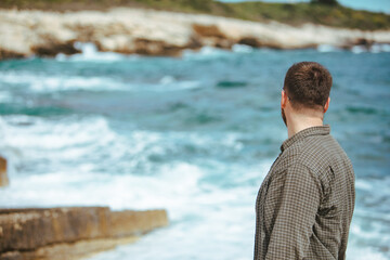 Fototapeta na wymiar young man in sunglasses with beard portrait at seaside