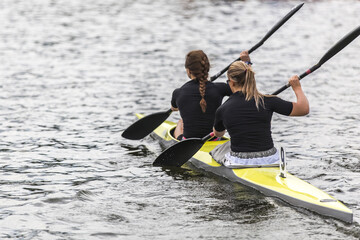 Women's professional kayaking themed photo.