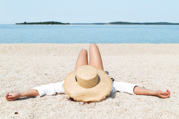 Fototapeta na wymiar woman sunbathing at sea beach. summer vacation