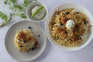 Home made chicken biriyani served with gooseberry pickle