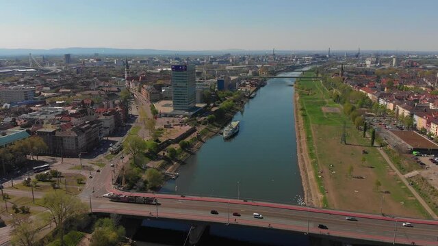 Top view of the embankment of the Neckar River. Bridges, green grass and trees. Germany.
