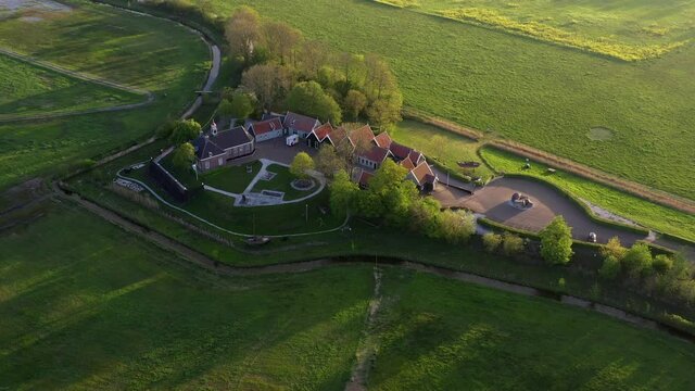 Aerial drone view slowly flying away from former island Schokland in the Netherlands, Unesco world heritage. Small museum settlement on former island