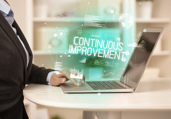 Side view of a business person working on laptop