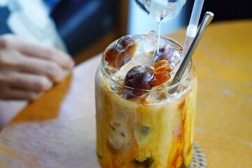 glass of ice coffee cube latte