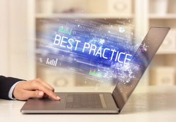 Closeup of businessman hands working on laptop