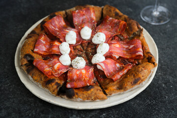 Traditional Italian pizza with sausage and ricotta