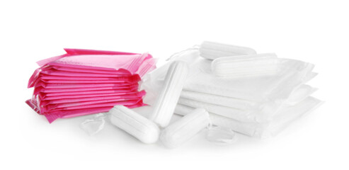 Tampons and disposable menstrual pads on white background © New Africa