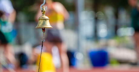 Bell in the finish line running track. Horizontal sport poster, greeting cards, headers, website