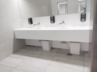 Public bathroom white interior sinks and mirror
