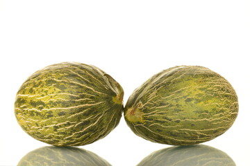 Two juicy ripe melons, close-up, isolated on white.