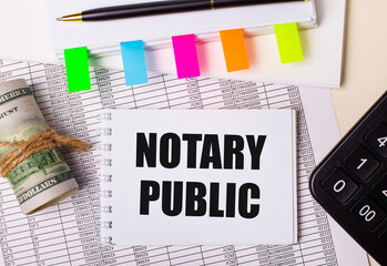The desktop has reports, notepads, calculator, pen, cash and notepad with colorful stickers and the text NOTARY PUBLIC