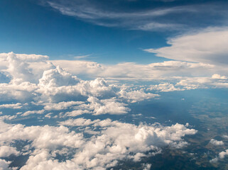 Naklejka na ściany i meble Aerial view of clouds from my airplane window.