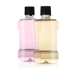 Bottles with mouthwash for teeth care on white background