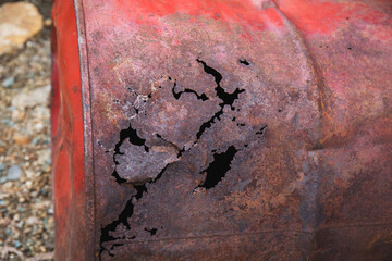 Rusty metal texture. Old barrel with corrosion. Scrap metal in a landfill.