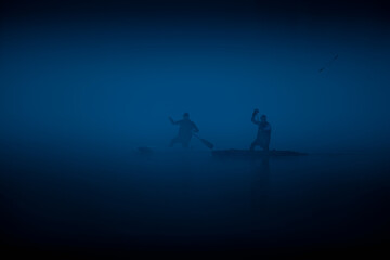 rowing on the river in the fog - 446660973