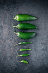 Flat lay of Green Habanero Peppers on Black  Background