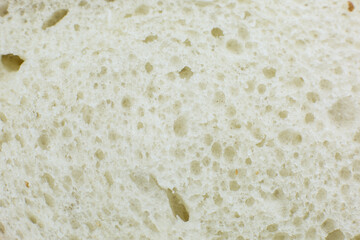Loaf of white bread inside texture background. Bakery concept. Close up, macro photo.
