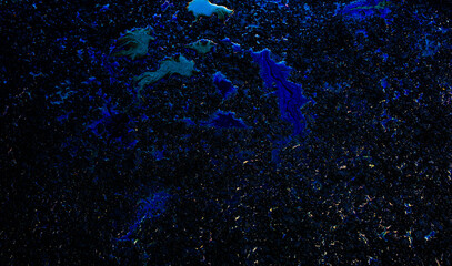 Oil stain on Asphalt road after rain, color Gasoline fuel spots on Asphalt Road