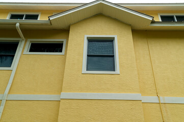 View of exterior of generic florida building or home showing roof peak.
