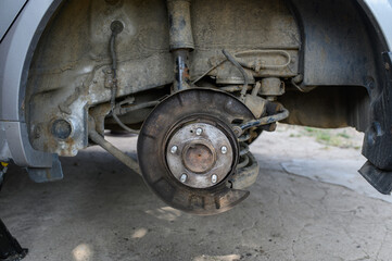 View of the old brake mechanism of the rear right wheel of the car