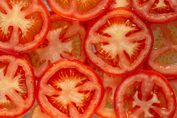 Macro Tomatoes,Tomato slices. Natural background with slices of tomato.