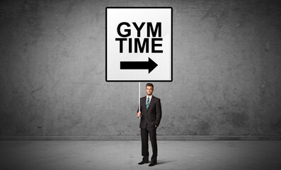 Obraz premium business person holding a traffic sign