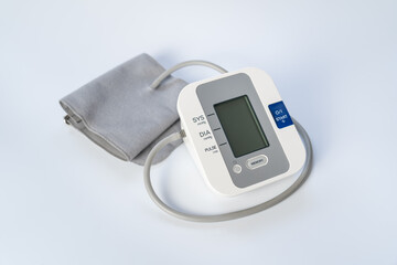 Apparatus for taking blood pressure on white background.