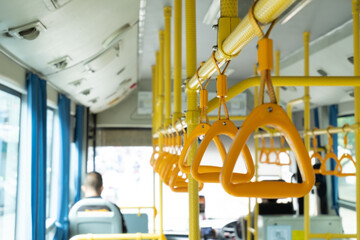 Yellow triangle handrails on buses.