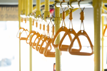 Yellow triangle handrails on buses.