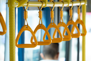 Yellow triangle handrails on buses.