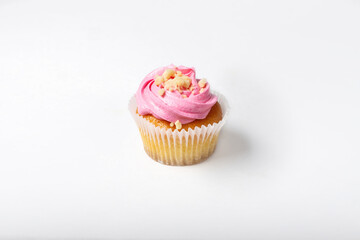 Cupcake on a white background. Cupcake with yogurt and strawberry cream. Strawberry cupcakes.